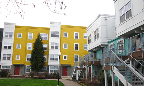 a group of buildings with different colors on them